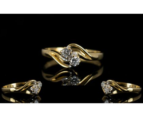 9ct Gold Two Stone Diamond Ring Set with brilliant cut diamonds set on a twist, fully hallmarked, ring size M