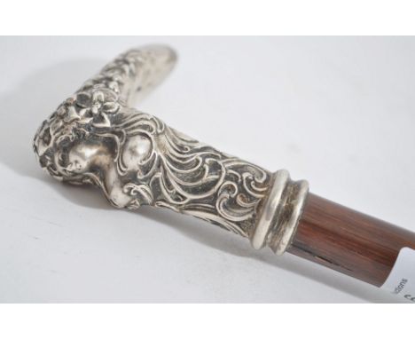 A 19th century gentleman's Art Nouveau&nbsp;silver and hazel wood walking stick / cane. The tapering wooden shaft with brass 