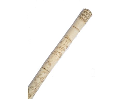 A 19th century Chinese bone walking stick cane. The tapering shaft of faux bamboo form decorated with scenes of monkeys eatin