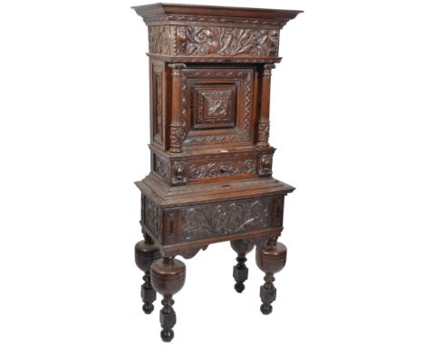 A late 17th / 18th century dutch / Flemish church vestry cabinet on stand. The solid oak carved two part cupboard and stand c