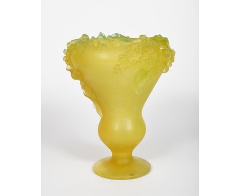 A Daum glass goblet vase,  footed form, cast with a band of berried foliage to the top rim, yellow glass with frosted finish,