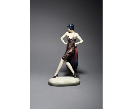A large Goldscheider Pottery model of a dancer designed by Josef Lorenzl,  model no.5940, modelled striding forward, wearing 
