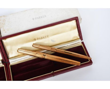 A Parker 61 Presidential  18ct gold fountain pen and ball pen, fine engine turned decoration, each in original fitted cases w