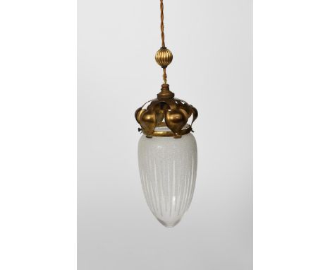 An Arts and Crafts ceiling pendant lantern, the brass frame with stamped foliate panels, clear and frosted glass shade unsign
