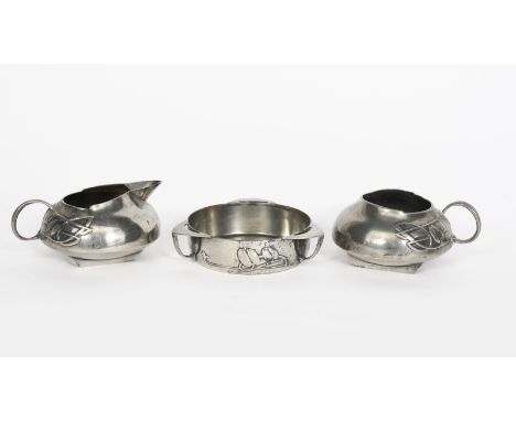 A Liberty &amp; Co Tudric Pewter milk-jug and sugar basin designed by Archibald Knox, model no.0231, cast in low relief with 