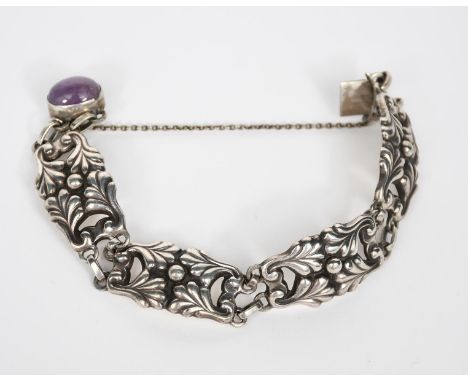 A Georg Jensen silver bracelet, model no. 5, each link cast with foliate design, the clasp set with amethyst cabochon, stampe