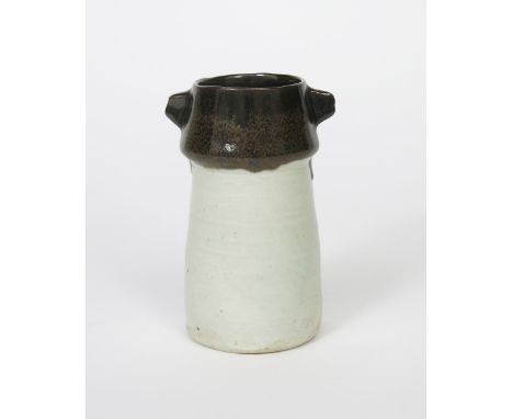 Janet Leach (1918-1997) a Leach Pottery stoneware lug-handled vase, tapering cylindrical form with knopped neck, the neck gla
