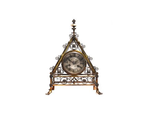 A rare and large Reformed Gothic brass mantel clock designed by Bruce Talbert,  probably manufactured by Cox &amp; Co or Hart