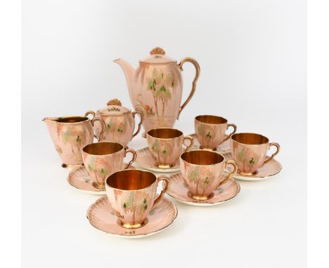 'New Storks' a Carlton Ware Rita coffee set for six, pattern no. 4344, enamelled in colours and highlighted in gilt on a pink