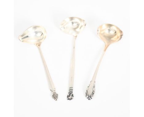 A Georg Jensen silver Acorn sauce ladle designed by Johan Rohde,  and two other Georg Jensen sauce ladles, stamped marks, 14c
