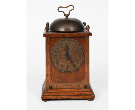 A Hamburg American Clock Company oak mantel clock retailed by Liberty &amp; Co, rectangular stepped base, the rectangular bod