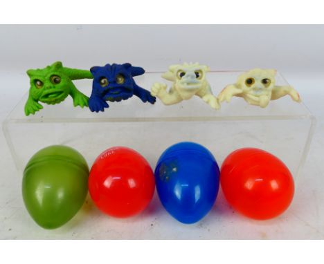 Boglins - Four vintage 'Baby Boglins' in original 'Eggs', including two 'Glow in the Dark' characters. Boglins appear to be i