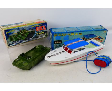 Marx - Schuco - Two boxed vintage battery operated plastic toys. Lot consists of a Marx Camouflaged Amphibious Duck - one of 