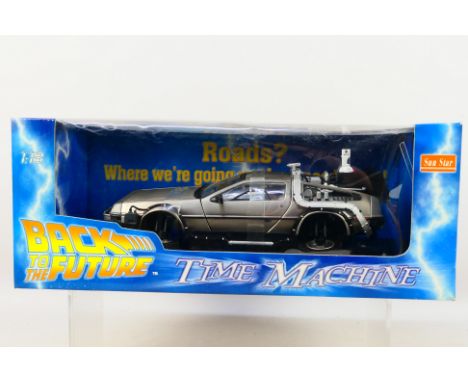 Sun Star - A boxed 1/18 scale diecast Back To The Future Delorean Time Machine #2710. Item appears mint in box. Box appears v