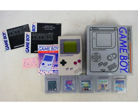 Nintendo Game Boy - A boxed Nintendo Game Boy (DMG-01) with games and owners manual. Untested. Battery compartment shows some