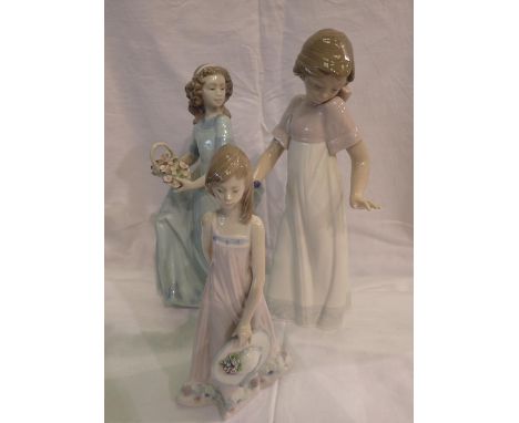 Two Lladro and one Nao figurines, largest H: 25 cm, Chip to finger of Lladro. P&amp;P Group 2 (£18+VAT for the first lot and 