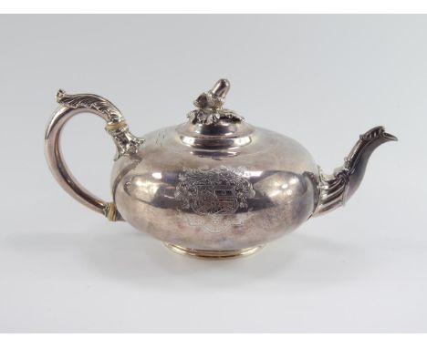 A Paul Storr silver teapot, with embossed leaf decoration to the handle and spout, acorn finial, the body engraved with a mar