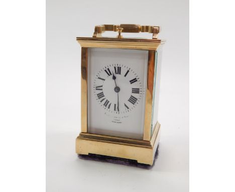 A French brass repeater carriage clock, late 19thC, enamel dial bearing Roman numerals, indistinct Leeds retailer, twin barre