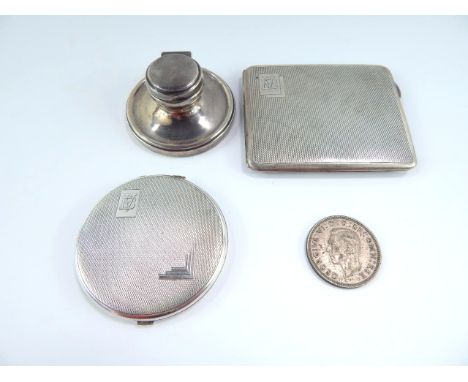 A George V silver cigarette case, with engine turned decoration, reserve monogram engraved, Birmingham 1935, matching compact