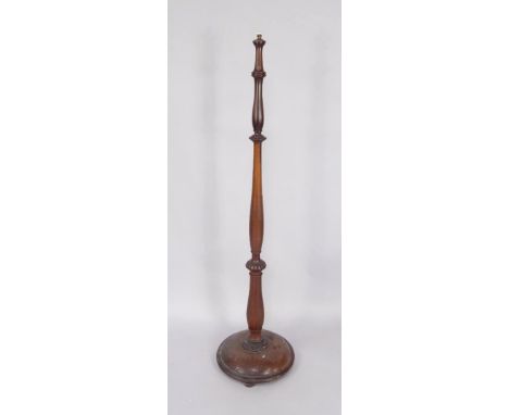A Victorian mahogany lamp standard, raised on a conical circular base, 167cm high.