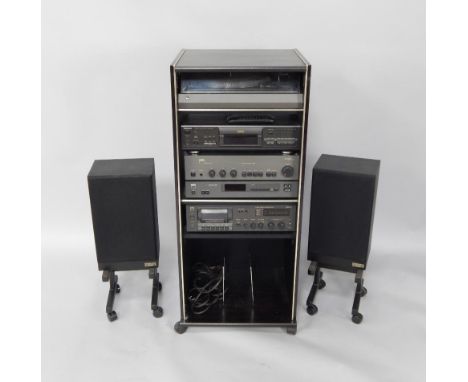 A hi-fi system comprising a NAD stereo cassette tape deck 6050C, stereo tuner 4150, stereo amplifier 3020, Technics compact d