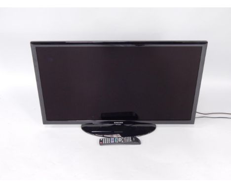 A Samsung 40 inch flat screen television, with remote control and manual.