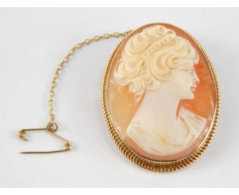 A 9ct gold and shell cameo brooch, bust portrait of a lady, with safety chain fitted.