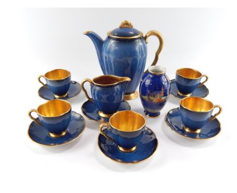 A Carltonware early 20thC porcelain part coffee service, decorated in gilt and powder blue, comprising coffee pot, cream jug,
