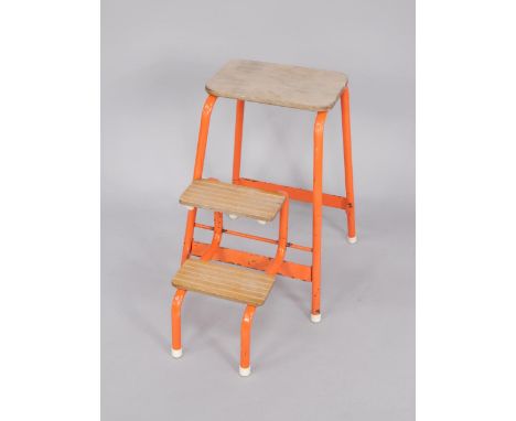 An orange metal and wooden step ladder.