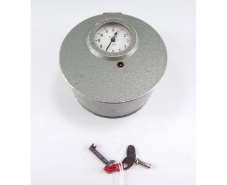 A Smiths Night Watchman's clock, early 20thC, cylindrical grey metal casing, white enamel dial bearing Arabic numerals, movem
