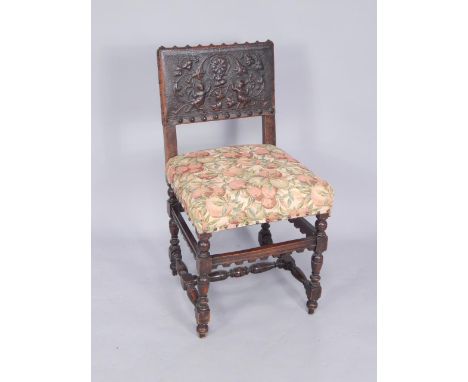 A 17thC style mahogany chair, with an embossed leather back, overstuffed tapestry seat, raised on turned legs united by a tur