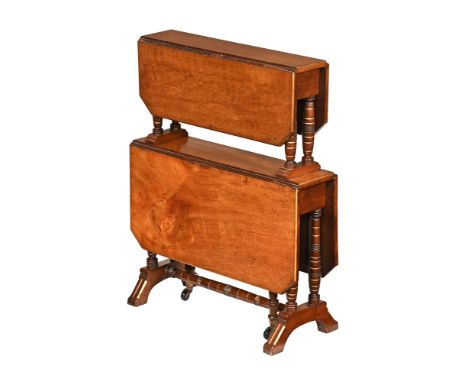 A mahogany double height Sutherland table, with canted leaves and gilt edging, on turned columns and stretcher, sledge feet. 