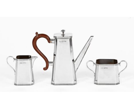 An Art Deco three piece silver coffee service, with coffee pot, cream and sugar.  Coffee pot height 14.5 cm, makers mark Char