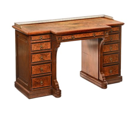 A Gillows of Lancaster breakfront desk, inlaid with burr wood, boxwood stringing etc, the top with brass gallery and tooled l