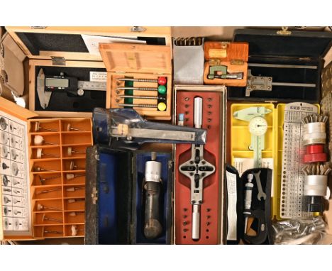 A collection of watch makers tools, micrometers, measures, precision tools, gauges etc.