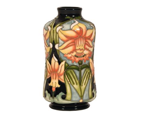 A Moorcroft pottery vase by W Sissons "Daffodil", also signed R Bishop.  Height 13.5 cm.