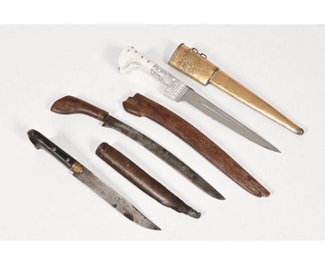 Three Eastern daggers, each with scabbard.  Longest 41 cm.  This bladed product is not for sale to people under the age of 18