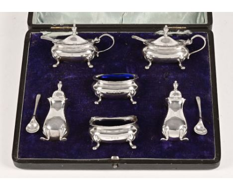 A cased silver condiment set Birmingham 1920, maker Walker & Hall.   CONDITION REPORT:  The condiment set has had little to n