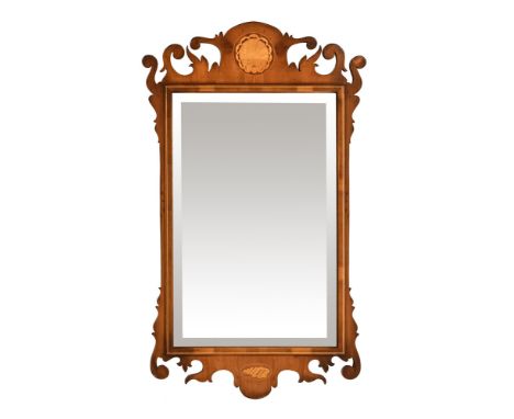 A Chippendale style fretwork mirror, with inlaid shell decoration.  Height 91 cm, maximum width 55 cm.