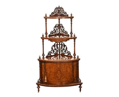 A Victorian walnut and inlaid corner whatnot, with fretwork decoration and turned carved pillars, with three shelves and cupb