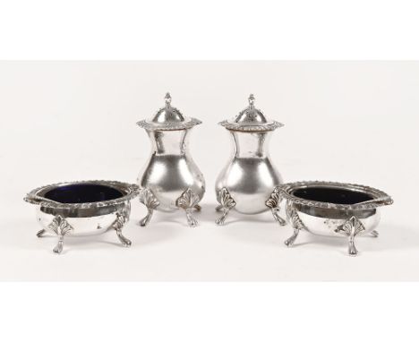 A pair of Birmingham silver boat shaped salts, each with blue glass liner and matching spoons, maker Laurence R Watson & Co 1