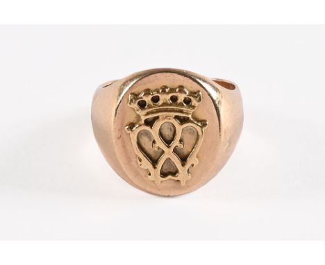 A 9 ct gold gentleman's signet style ring, with armorial crown design.  Size R, weight 12.7 grams.   CONDITION REPORT:  The r