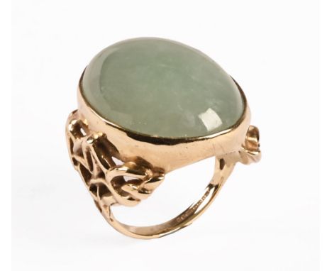 A 9 ct gold dress ring, with jade coloured stone.  Size N, gross weight 12.7 grams.