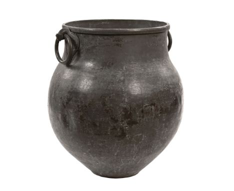 An early 20th century large bronze vessel, probably Indian.  Height +/- 76 cm, the handles in the form of stylised cockerels 