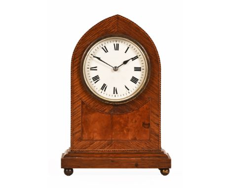 An Edwardian inlaid oak and walnut mantle clock, of lancet shape, single train.  Height 22 cm, width 15 cm, depth 8.5 cm.