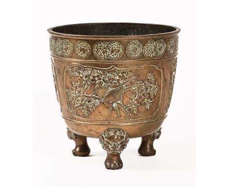 A Chinese bronze planter, decorated with birds and with lion mask feet.  Height 30 cm, width 30 cm (see illustration).
