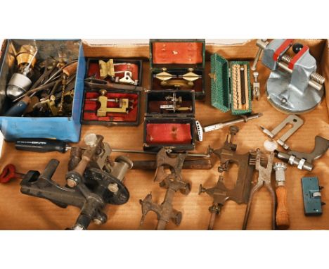 A collection of watch makers tools, depth gauges, small vice, precision tools etc.