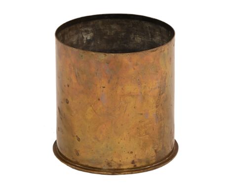A First World War German shell case, dated 1916.  Height 23 cm, diameter 22 cm.