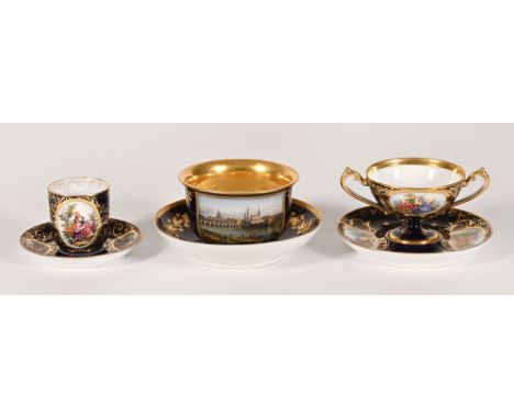 A Dresden porcelain cabinet cup and saucer, with town scene.  Saucer diameter 15.5 cm, together with a coffee can and saucer 