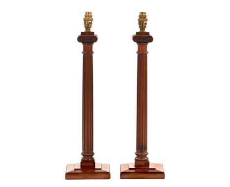 A pair of Edwardian mahogany column table lamps, with Doric capitals and rectangular bases.  Height including light fitting 6